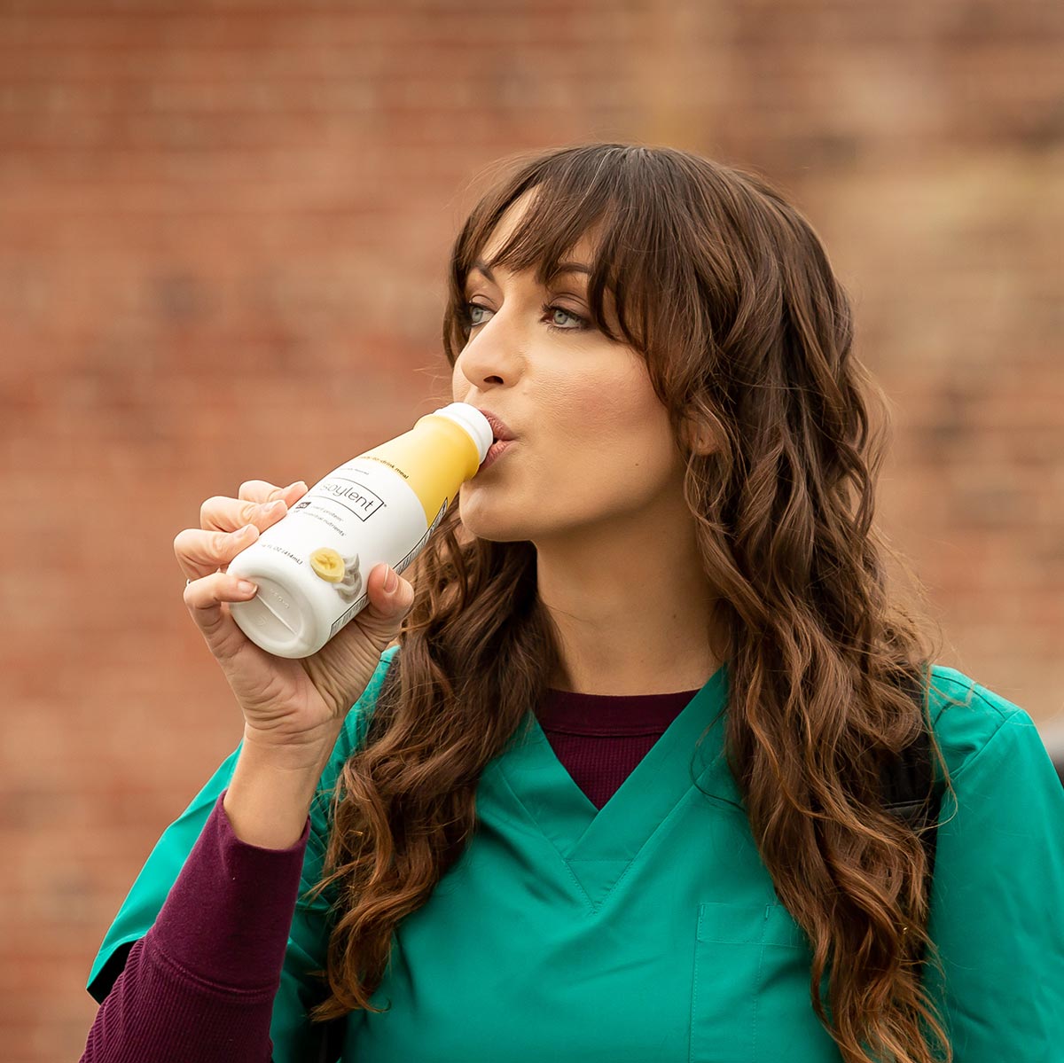 Woman drinking Soylent