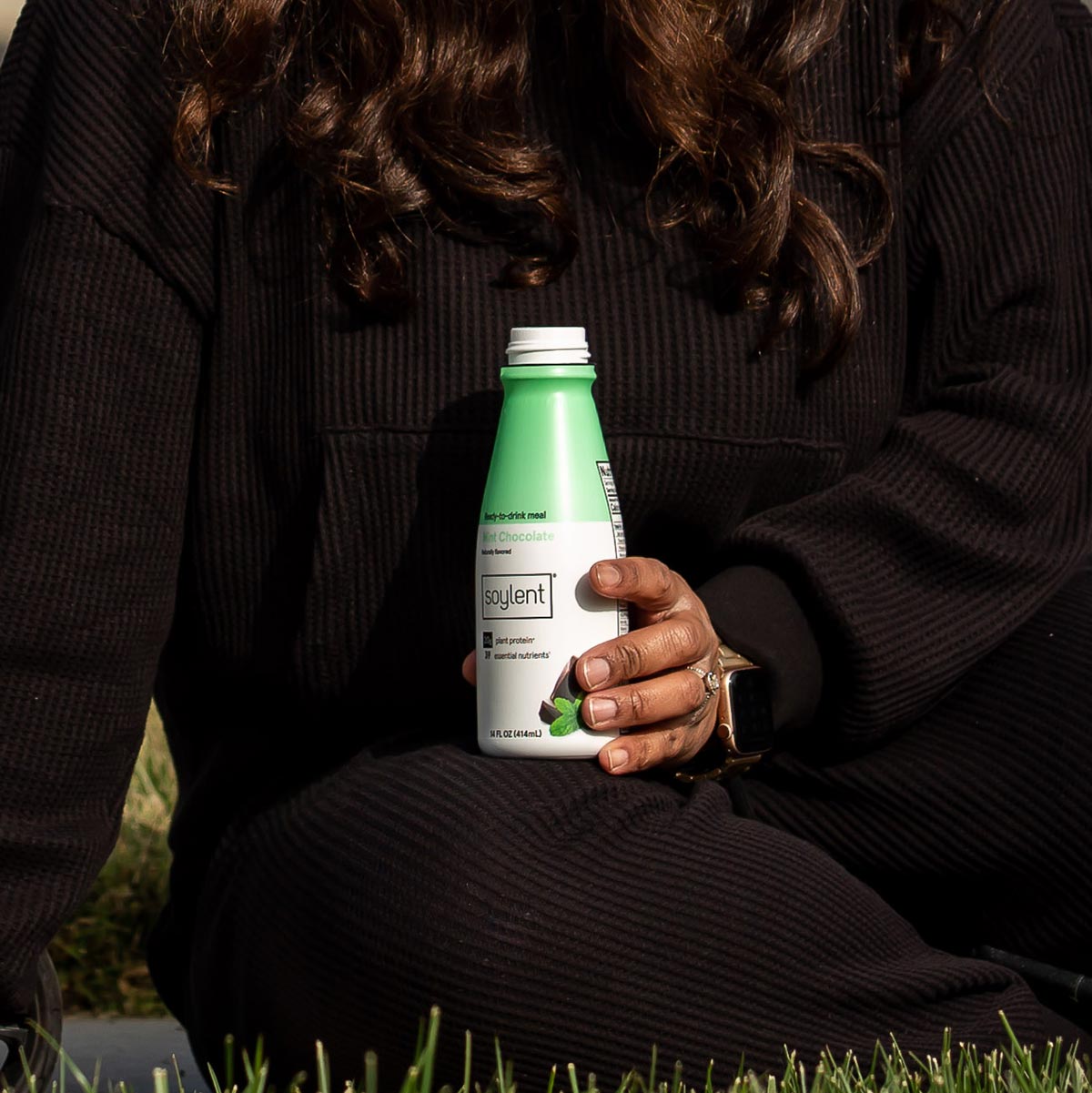 Person holding Soylent Drink Mint Chocolate