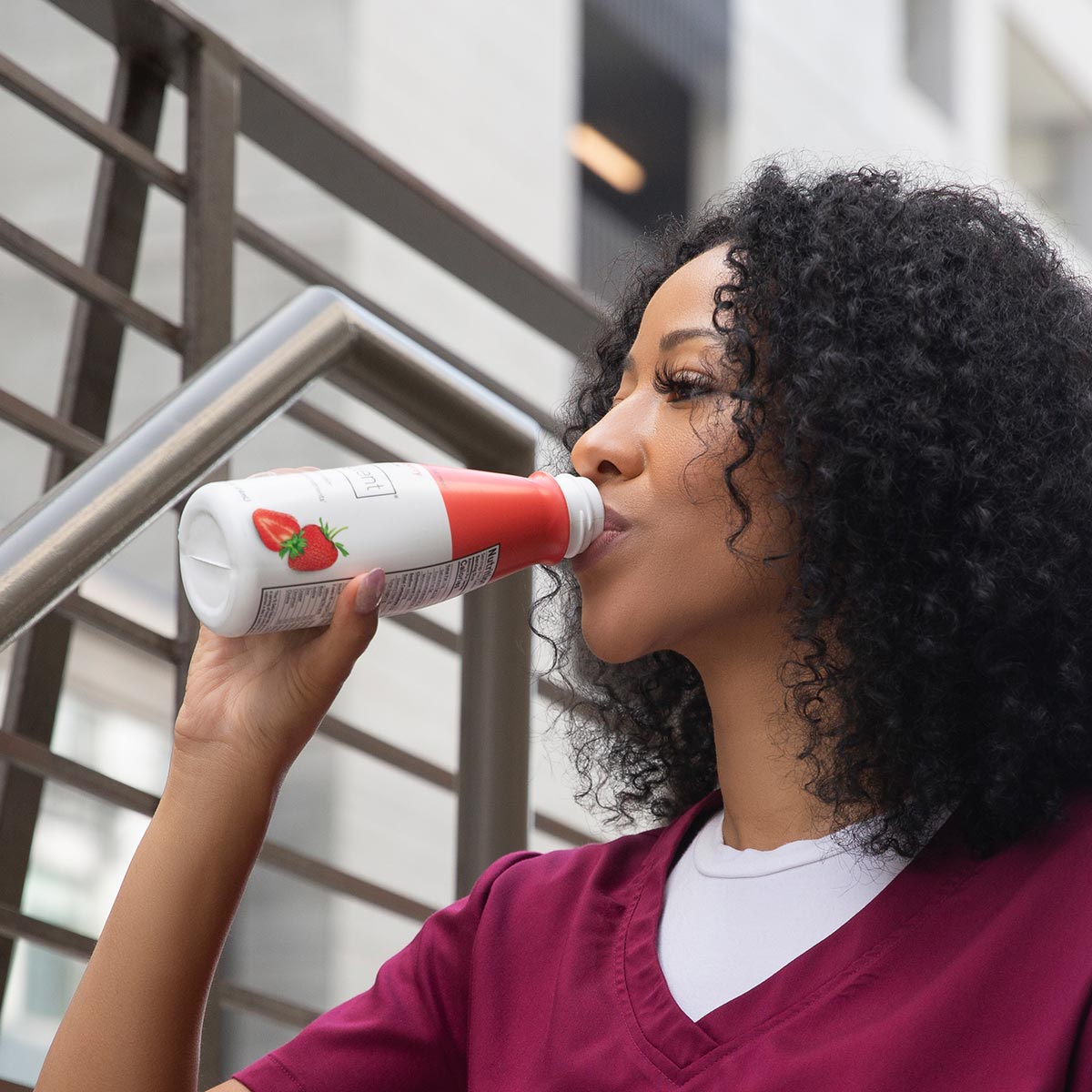 Person drinking Soylent Drink Strawberry